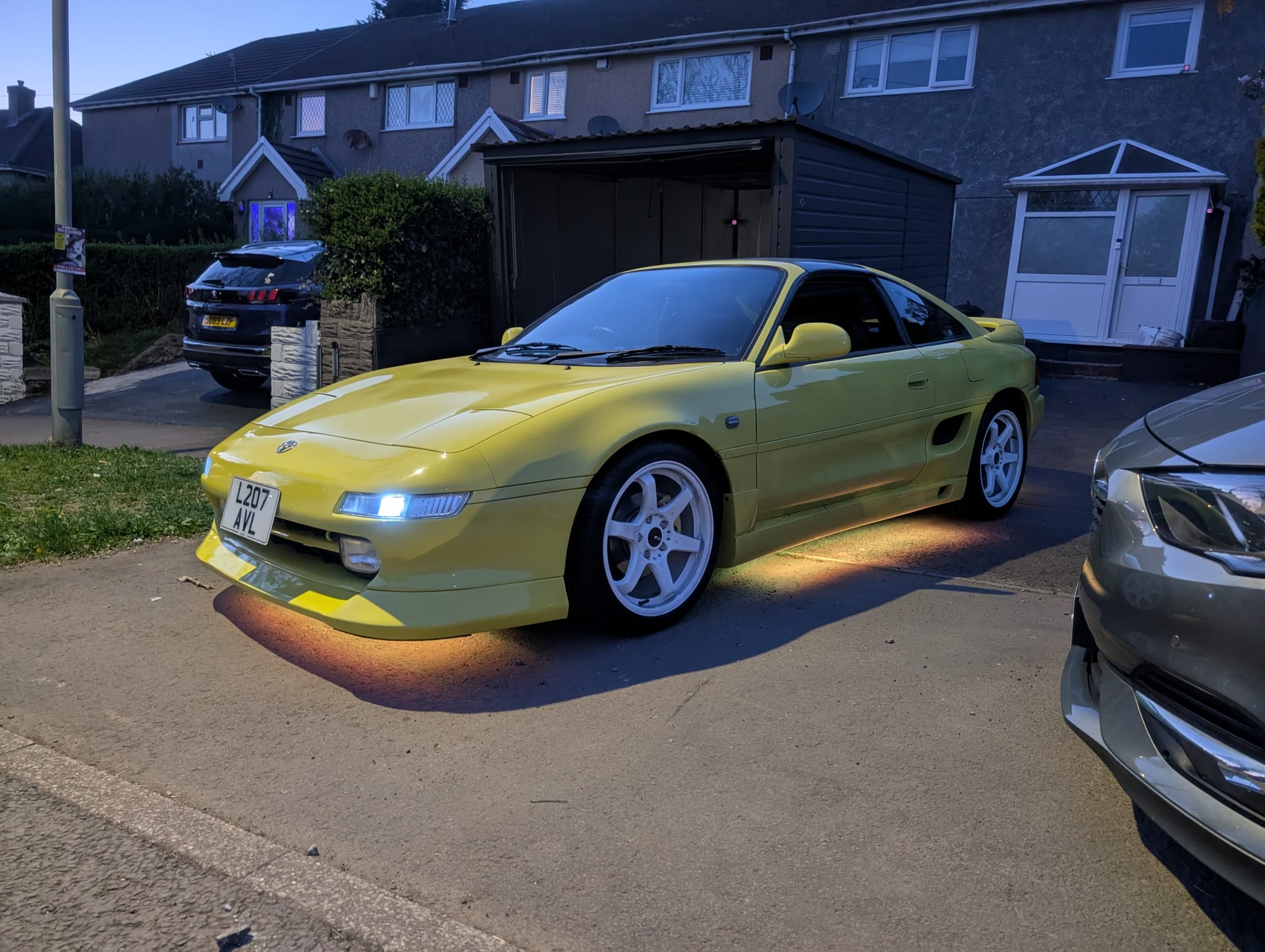 Yellow MR2 MK2 at night